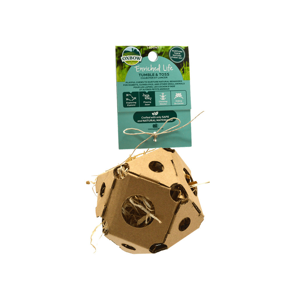 Cardboard ball with small holes and hay stuffed inside